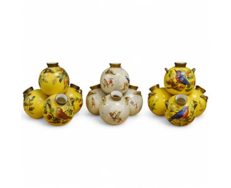 Three Royal Worcester 'pyramid' vases, painted with birds, 14cm high. Condition - fair/good The pair all gilt handles and nec