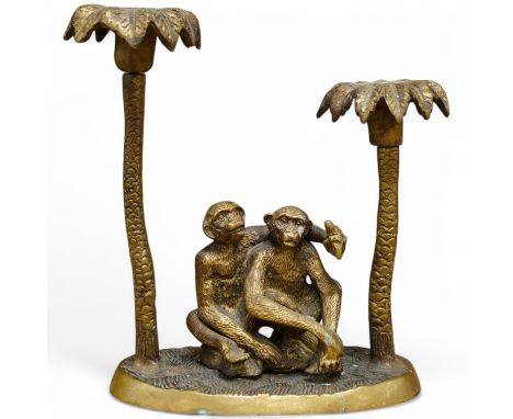 A brass two branch candleholder in the form of palm trees and monkeys, 22cm high. Condition - fair