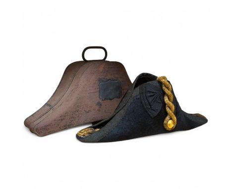 A Naval Lieutenant's bi-corn hat, in its tin case, with applied plaque for D. Donavon R.N. Condition - fair, with general sur