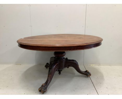 A Victorian circular mahogany tilt top tripod breakfast table with claw feet, diameter 136cm, height 72cm. Condition - poor