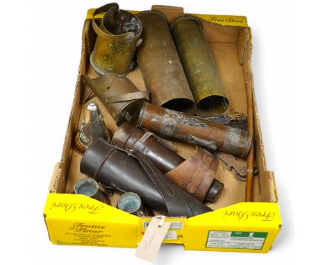 A collection of First World War trench art including engraved shell cases, mounted bullets in the form of a table lighter, as