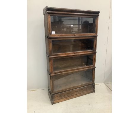 A Globe Wernicke oak four section bookcase, width 86cm, depth 27cm, height 151cm. Condition - fair