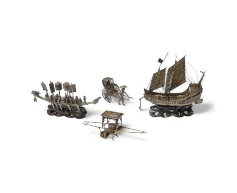 A Chinese white metal miniature model of a junk, length 11.2cm, on a wooden stand, a similar late 19th/early 20th century min