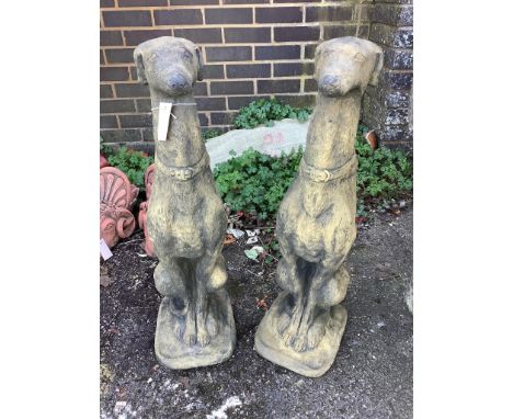 A pair of cast seated greyhound garden ornaments, height 74cm. Condition - good