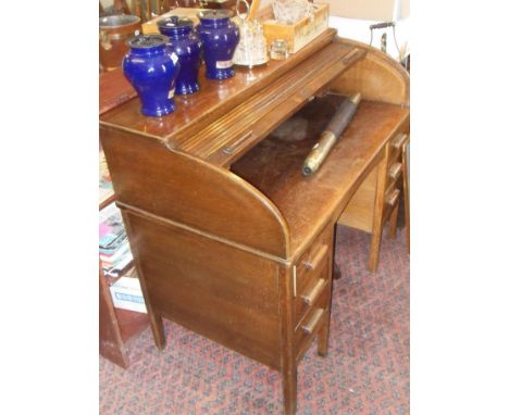 Oak roll top desk with brass label to escutcheon reading "The Lebus Desk"