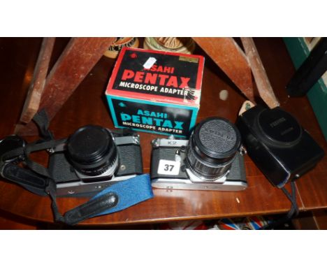Pentax K1000 and K2 cameras, together with a Pentax microscope adapter (boxed), and a Profisix light meter