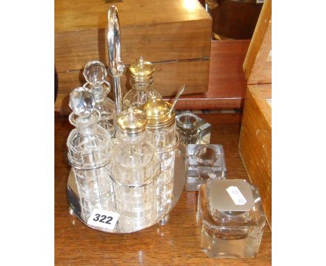 Art Deco cut-glass inkwell, two other inkwells and a condiment set on plated stand
