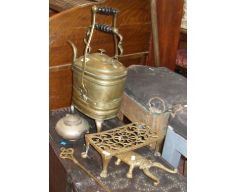 Victorian brass kettle on trivet, a candlestick, "The Perfect Tea Pot" (A/F), iron beetle boot puller, a toasting fork and an