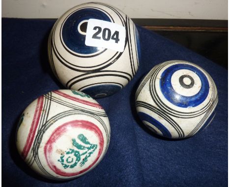 Three 19th c. painted ceramic carpet bowls