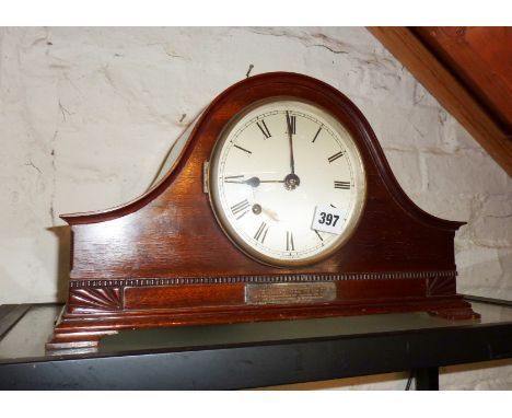 Mahogany mantle clock with silver presentation plaque dated 1932