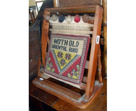 Unusual Persian carpet shop display scale model of a weaving loom with completed hand-woven carpet which reads "Moth Old Orie