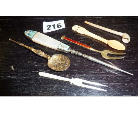Silver gilt and guilloche enamel pickle fork by Aksel Holmsen of Norway, a miniature clay pipe and other small utensils/cutle