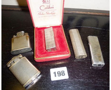 Vintage Colibri lighter in case, with four other lighters