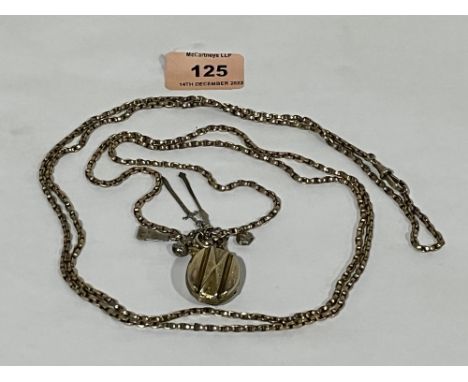 A 9ct chain with a 19th century locket containing a lock of hair, suspended with a gold charm and silver charms commemorating