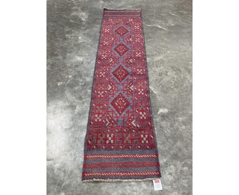 A Meshwani carpet runner. 2.43m x 0.53m.