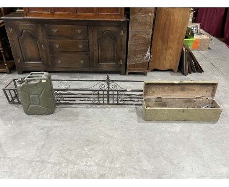 A wrought iron window box, 96" long; a 1950s military jerry can and a box of tools.