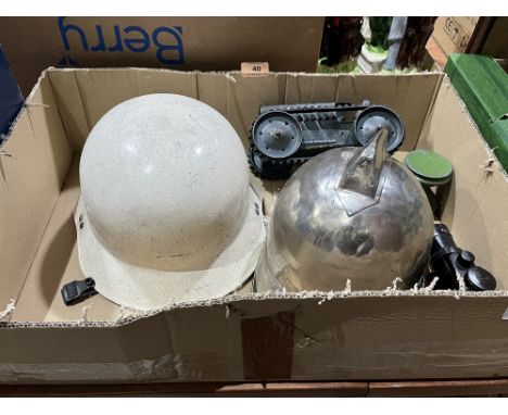 A Triang clockwork tractor, two helmets, a gun sight and a yo-yo.