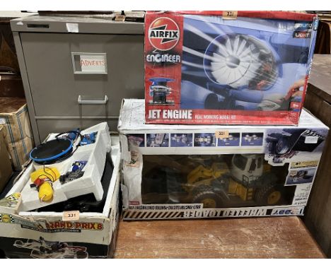 A Scalextric set; an Airfix jet engine construction kit and a boxed model wheeled loader.