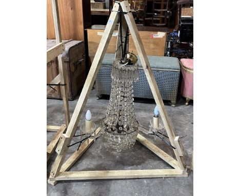 A three light chandelier hung with prismatic and pendant drops. 29" high.