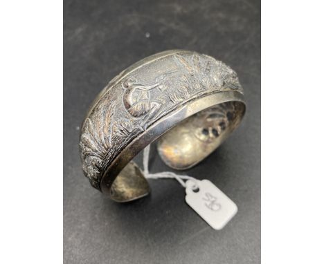 A Silver Cuff Bangle With Hunting Scene