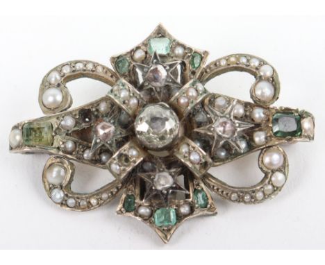 A diamond, peridot, pearl and topaz set brooch, large central diamond (circa 0.5ct) surrounded by four stars set with diamond