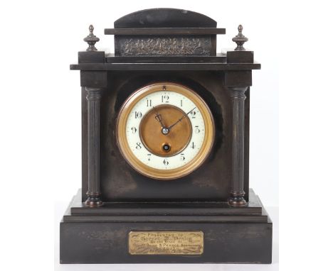 A late Victorian slate mantle clock, white enamel ring dial with Arabic numerals, Corinthian column design case, with plaque 