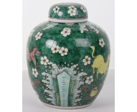A large Chinese ginger jar, Kangxi mark, decorated throughout with green roundels, flowers and Qilin, 25cmH