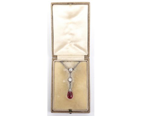 A fine diamond and ruby drop necklace, two round cut diamonds (circa .4ct each) over single ruby tear drop (circa 1ct), on wh