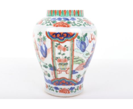 A Chinese Wucai vase decorated with qilin, possibly 17th century Transitional period, 18cmH, with a group of Chinese ceramic 