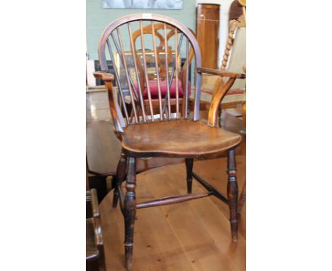 An early Victorian elm stick back Windsor armchair