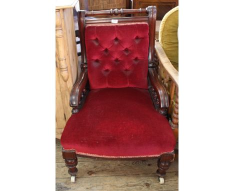 A mid 19th Century mahogany framed armchair with bobbin turnings and red velvet upholstery