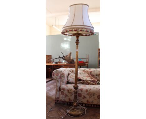 A gilded wood standard lamp