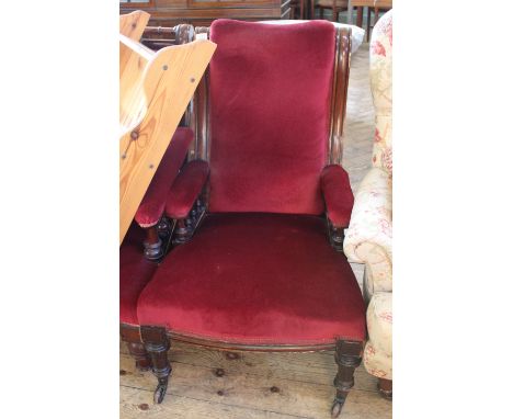 A mid 19th Century framed armchair with bobbin turnings and red velvet upholstery