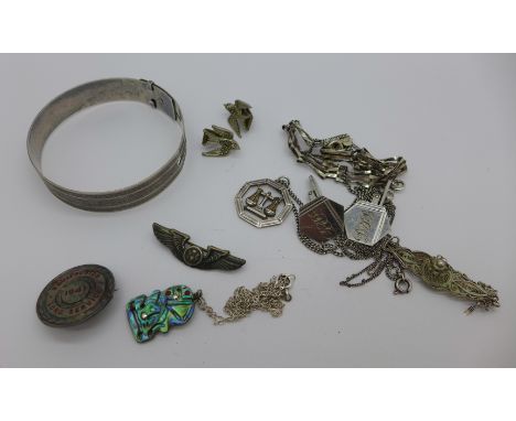 Silver jewellery including a Charles Horner bangle, a silver badge and a pair of marcasite set earrings