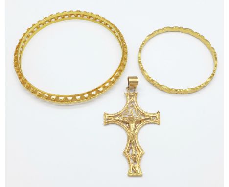Three items of yellow metal jewellery, a bangle marked 21c, 12.9g, a child's bangle, 8.6g and a crucifix, 5.7g, small bangle 