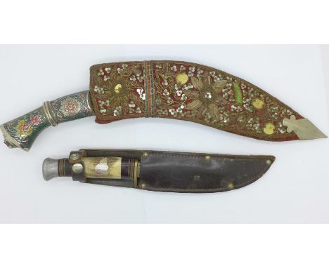 A Kukri with white metal and enamel handle with decorated scabbard and a scout knife