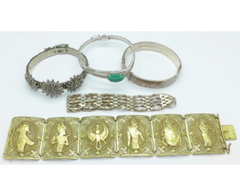 A silver bangle, silver gate bracelet, an 800 silver and malachite bracelet, an 835 silver gilt Egyptian revival bracelet, (1