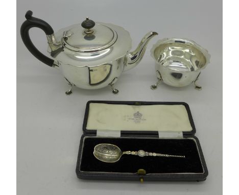 A silver teapot, silver sugar basin and a silver spoon, 520g