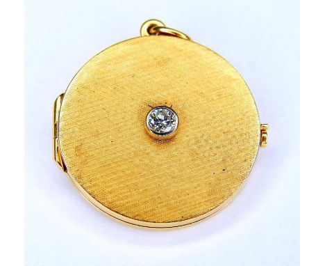   Rundes Fotomedaillon  18 K Gelbgold. Rundes Medaillon mit mittigem Diamantbesatz von ca. 0,25 ct. Seitlicher Hakenverschlus