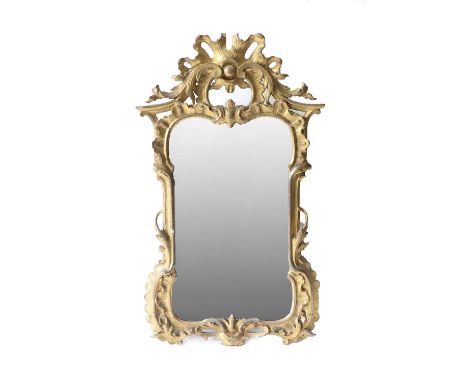 A George II Carved Giltwood and Gesso Mirror, possibly Irish, circa 1755, the mercury mirror plate within a C scroll moulded 