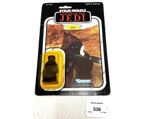 Kenner vintage Star Wars Return of the Jedi Jawa 3 3/4" figure, Mint, within Near Mint (yellowed) bubble, upon Fair to Good (