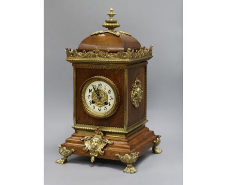 A French oak brass mounted mantel clock