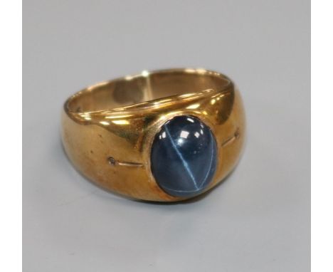 A 10k gold and cabochon blue star sapphire ring, size Q.