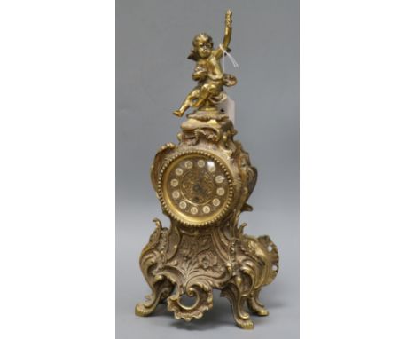 A French ormolu mantel clock, mounted with a cherub height 42cm