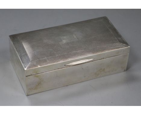 An engine turned silver cigarette box, 16.5cm.