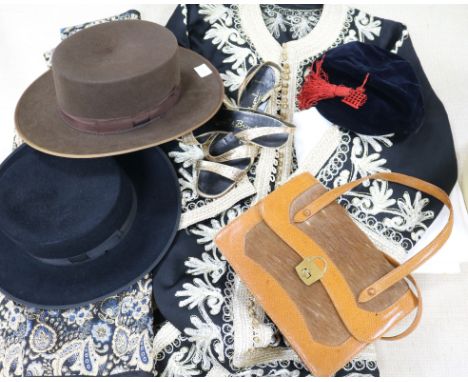 Two Spanish hats, hat box, a kaftan, a Jaegar blouse, a calf skin handbag, a pair of evening gloves, a school cap, linen etc.