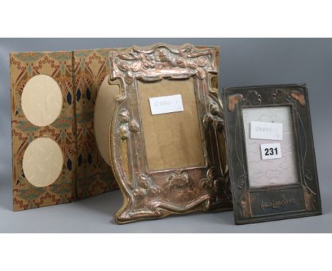 An Art Nouveau copper photo frame, an Arts &amp; Crafts copper photo frame and a Liberty &amp; Co fabric triptych photo frame