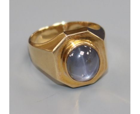 A 14k gold and cabochon star sapphire octagonal ring, size Q.