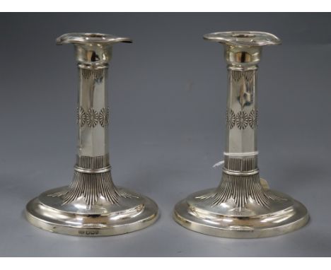 A pair of late Victorian silver candlesticks, George Howson, Sheffield, 1900, 16cm.