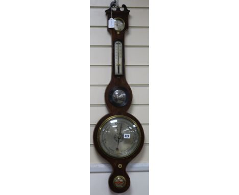 A Regency mahogany wheel barometer , bears label Belfast